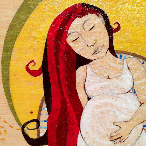pregnant woman with red hair and eyes closed