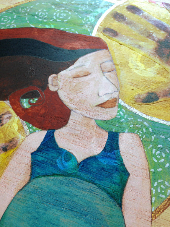 detail view of a painting of a pregnant woman with delicate spiral details