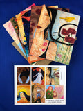 6 note cards, each with a different print of Lea K. Tawd's art, on a blue background.  The cards are fanned out at the top of the image, and below them is a flat card showing all 6 images included in the set. 