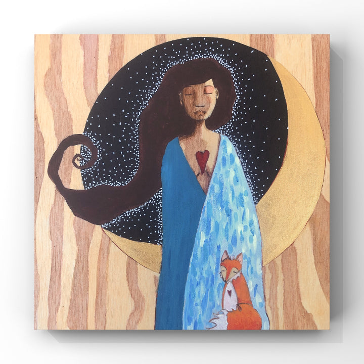 print of blue-robed woman and her fox companion standing in front of a golden crescent moon.  