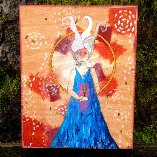 painting of a young white haired woman in a blue dress holding a large thistle.  The background shows wood grain, red and orange collaged paper, and white and green marks in spiral patterns