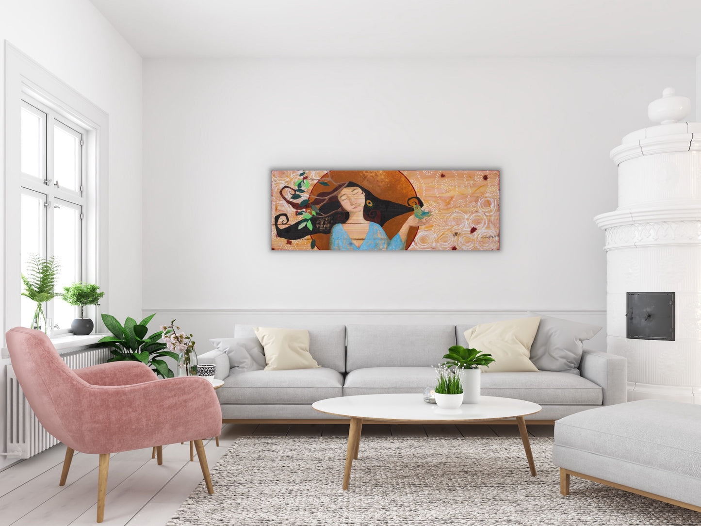 large mixed media painting on wood depicting a beautiful woman holding a bird in her hand.  The painting is on the wall of a living room with white furniture, a pink chair and green plants